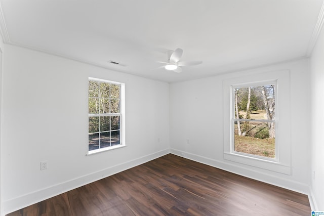 unfurnished room with dark hardwood / wood-style floors, ceiling fan, ornamental molding, and a wealth of natural light