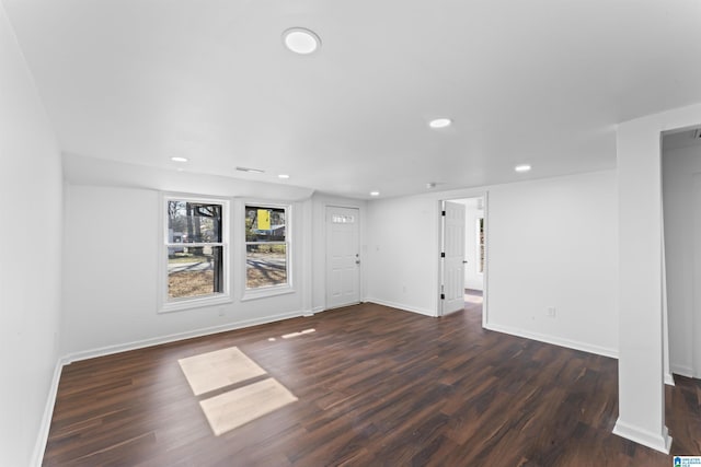 spare room featuring dark hardwood / wood-style floors