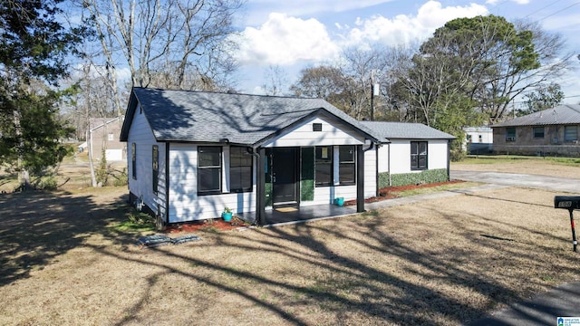 view of front of home with a sunroom