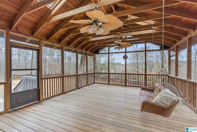 unfurnished sunroom with ceiling fan, wood ceiling, and lofted ceiling