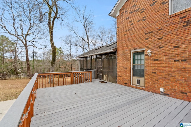 wooden deck featuring a sunroom