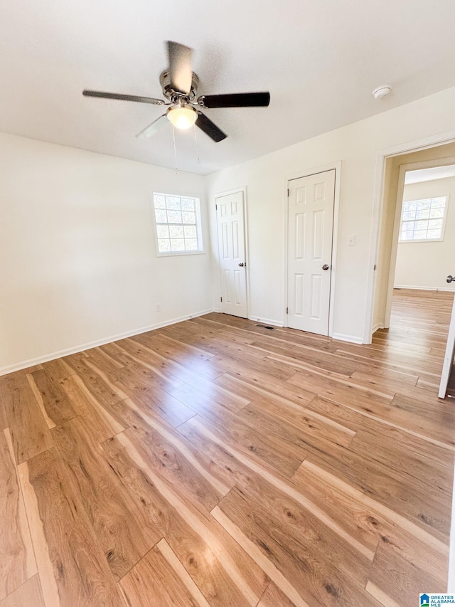 unfurnished bedroom featuring ceiling fan and light hardwood / wood-style flooring