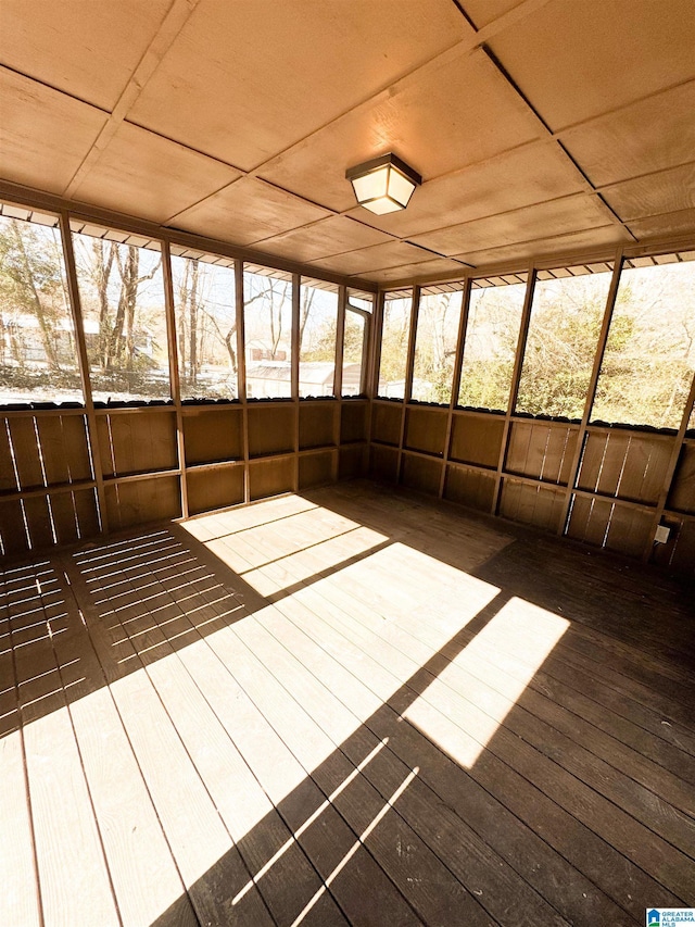 unfurnished sunroom with wood ceiling