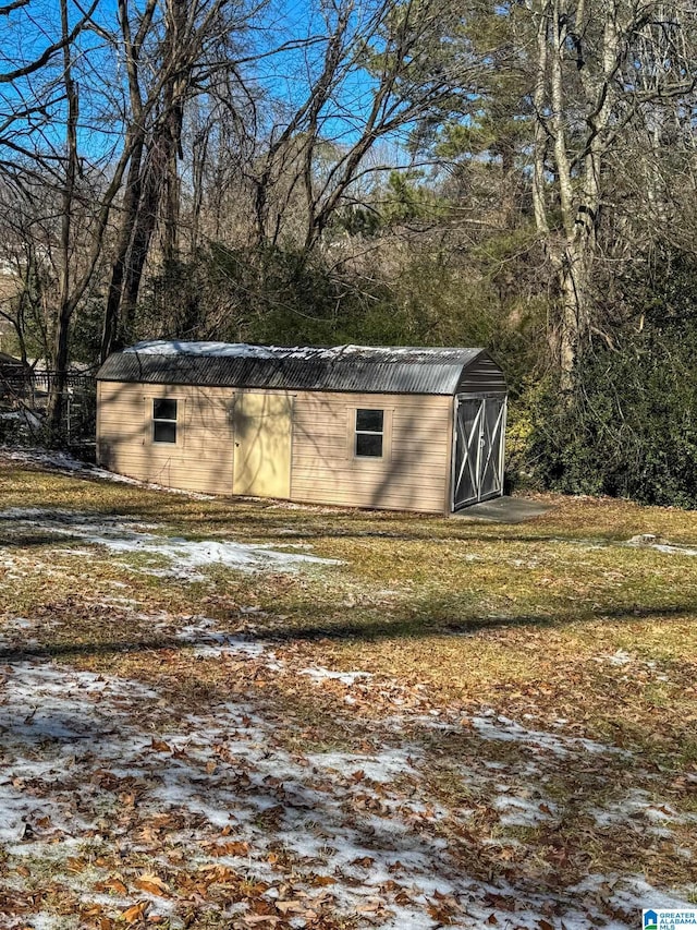 view of outbuilding with a yard