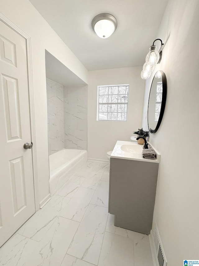 bathroom featuring vanity and a tub