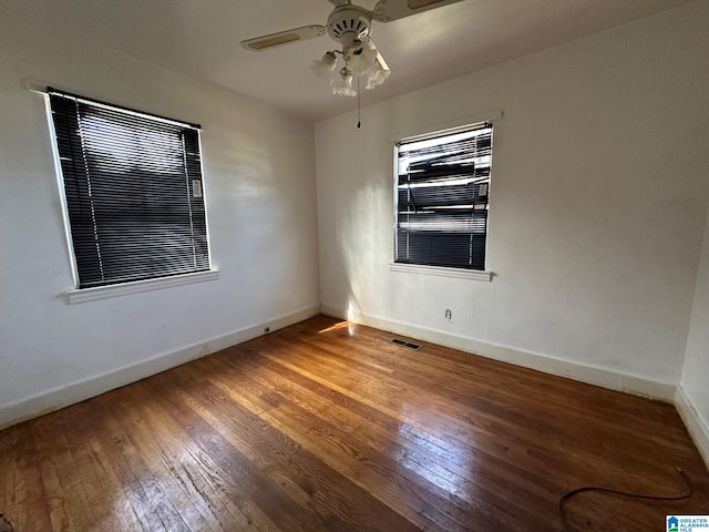 unfurnished room featuring hardwood / wood-style floors and ceiling fan