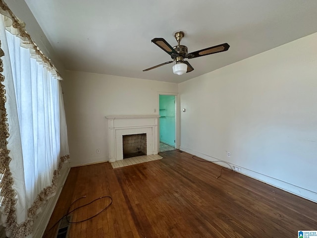 unfurnished living room with hardwood / wood-style floors and ceiling fan