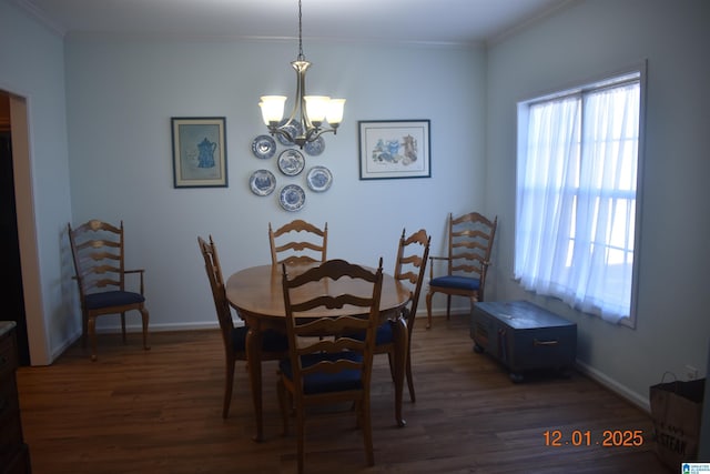 dining room with ornamental molding, a wealth of natural light, and an inviting chandelier