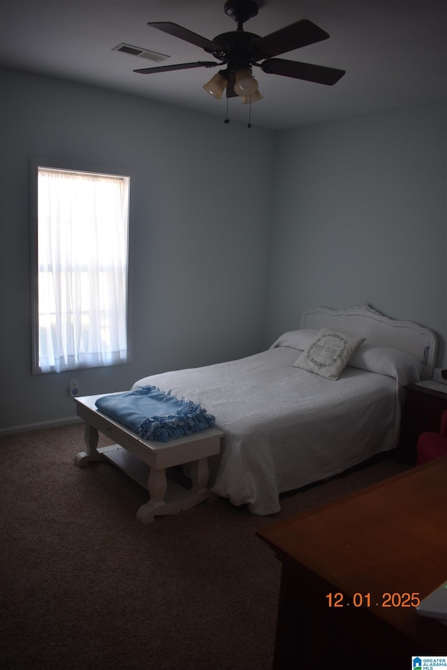 carpeted bedroom featuring ceiling fan