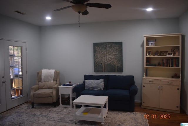 living room with french doors, hardwood / wood-style flooring, and ceiling fan