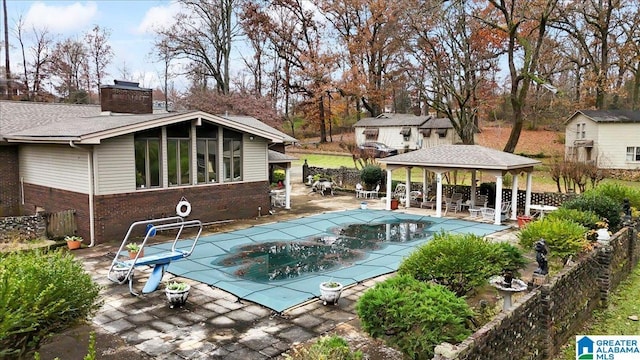 view of pool featuring a gazebo and a patio