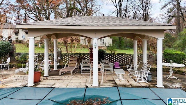 view of swimming pool featuring a gazebo