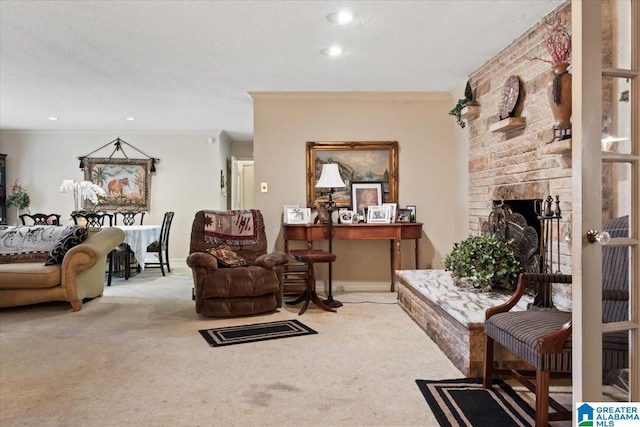 living room with carpet flooring, a stone fireplace, a textured ceiling, and ornamental molding