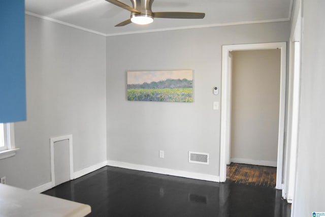 unfurnished dining area with ceiling fan, crown molding, and dark wood-type flooring