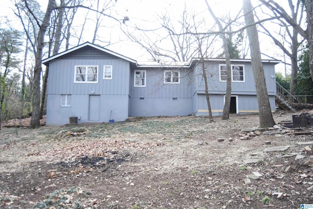 back of house with central AC