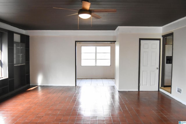 spare room with ceiling fan and wood ceiling