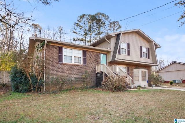 split level home featuring a front lawn