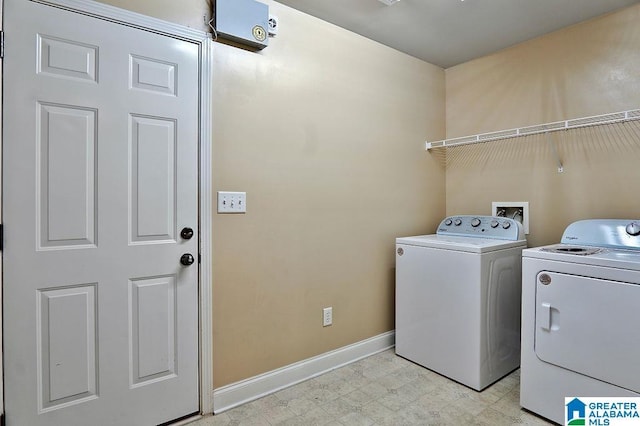 clothes washing area featuring washing machine and dryer