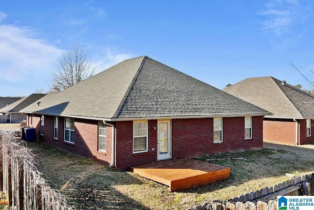 rear view of property with a wooden deck