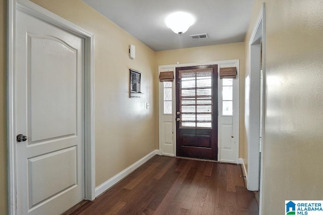 entryway with dark wood-type flooring