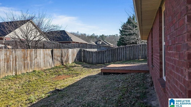 view of yard with a wooden deck