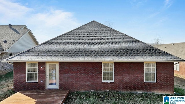 back of house with a wooden deck