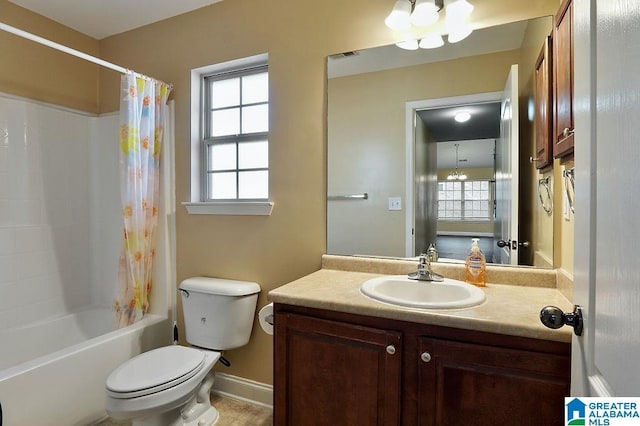 full bathroom featuring a chandelier, shower / bath combo, vanity, and toilet