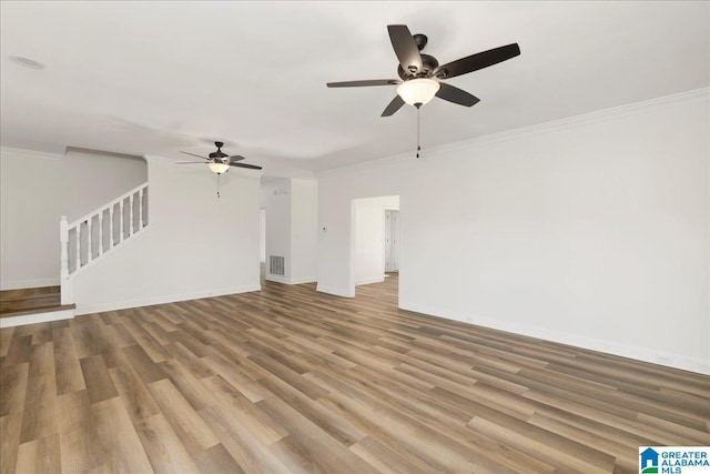 unfurnished living room with ceiling fan, ornamental molding, and hardwood / wood-style flooring