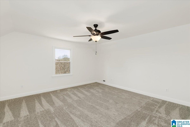 carpeted empty room featuring ceiling fan