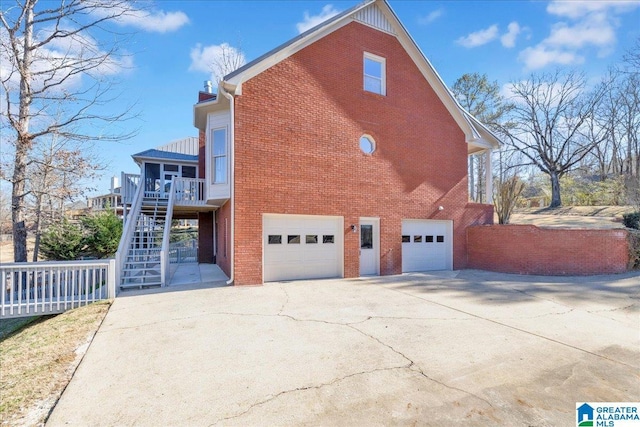 view of side of property with a garage