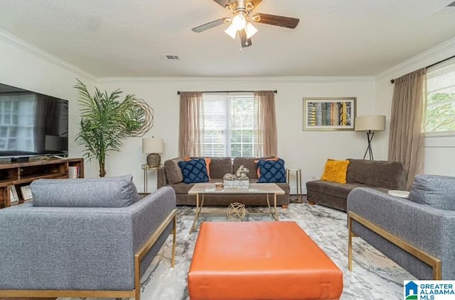 living room featuring crown molding and ceiling fan