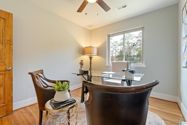 office space with ceiling fan and light hardwood / wood-style flooring