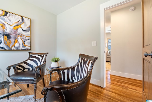 sitting room with light hardwood / wood-style flooring