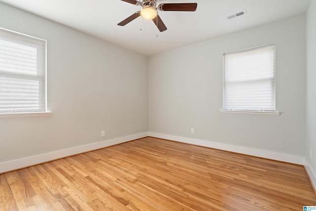 spare room featuring ceiling fan and light wood-type flooring