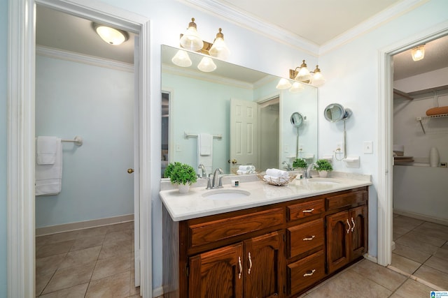 bathroom with tile patterned flooring, vanity, and ornamental molding