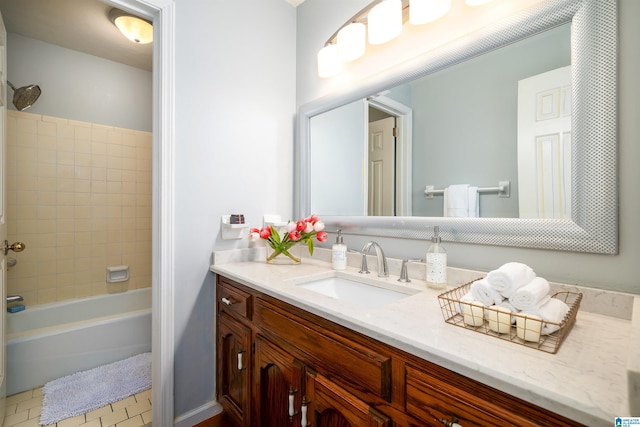 bathroom featuring vanity and tiled shower / bath combo