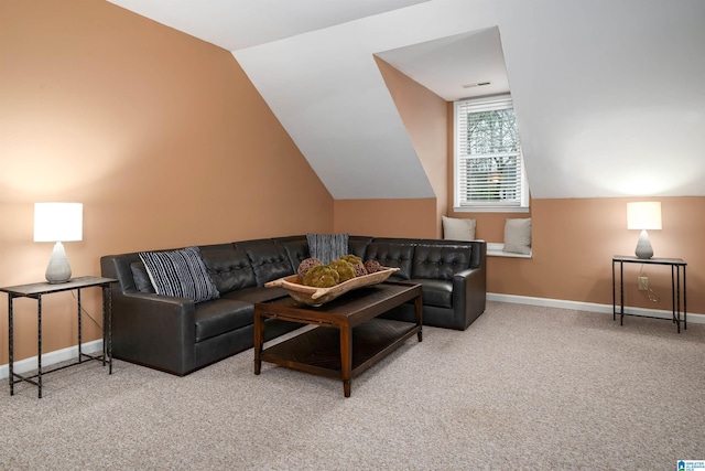 living room featuring lofted ceiling and carpet floors