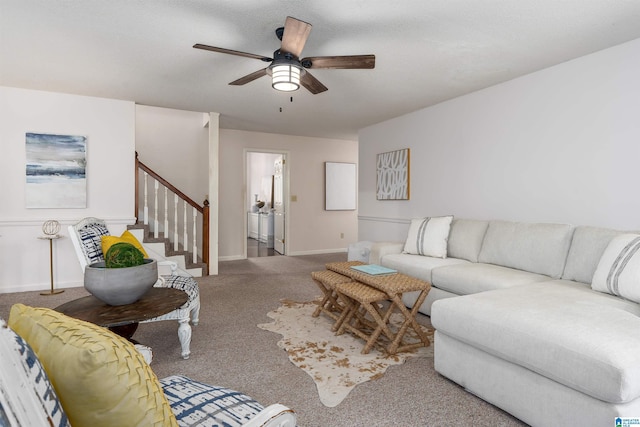 living room with carpet and ceiling fan