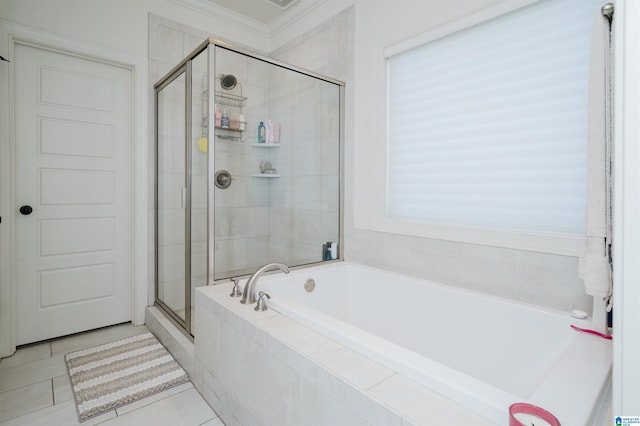 bathroom with plus walk in shower, tile patterned floors, and ornamental molding