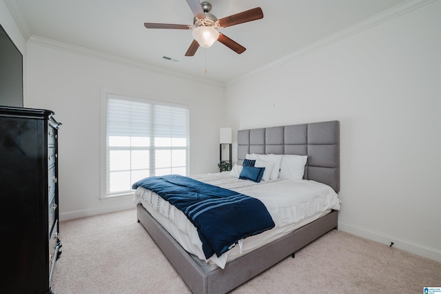 bedroom with ceiling fan, light colored carpet, and crown molding