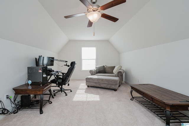 office space with ceiling fan, lofted ceiling, and light carpet