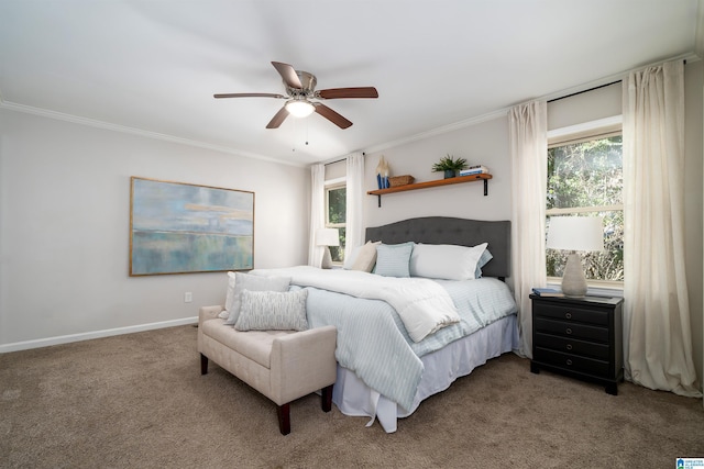 carpeted bedroom featuring ceiling fan, crown molding, and multiple windows