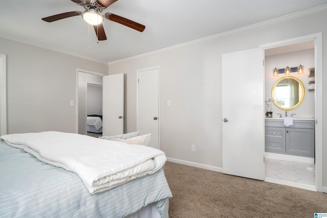 carpeted bedroom with ceiling fan, crown molding, and connected bathroom