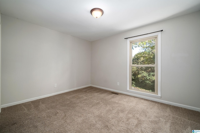 empty room featuring carpet flooring