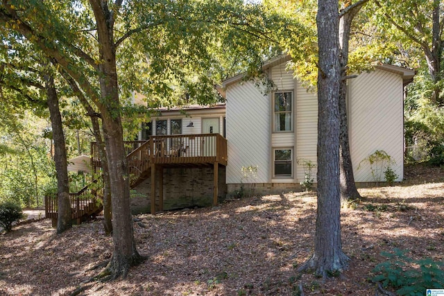 back of property with a deck