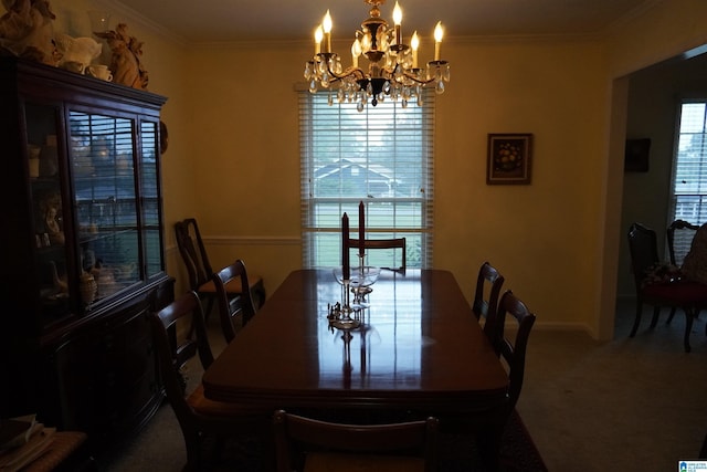 carpeted dining room with a notable chandelier and ornamental molding