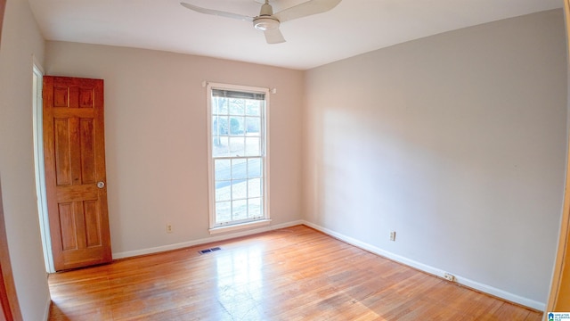 unfurnished room featuring light hardwood / wood-style flooring and ceiling fan