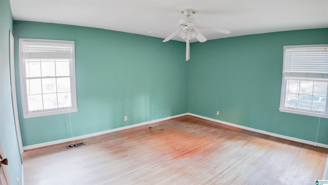 unfurnished room featuring ceiling fan and light hardwood / wood-style flooring