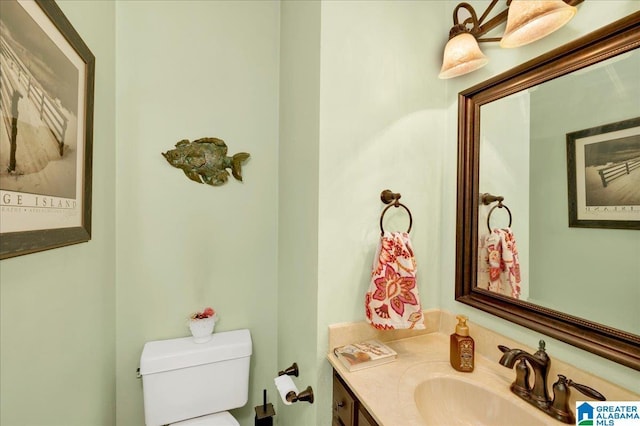 bathroom with toilet and vanity