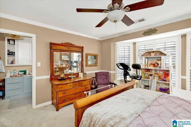 carpeted bedroom with ceiling fan and crown molding